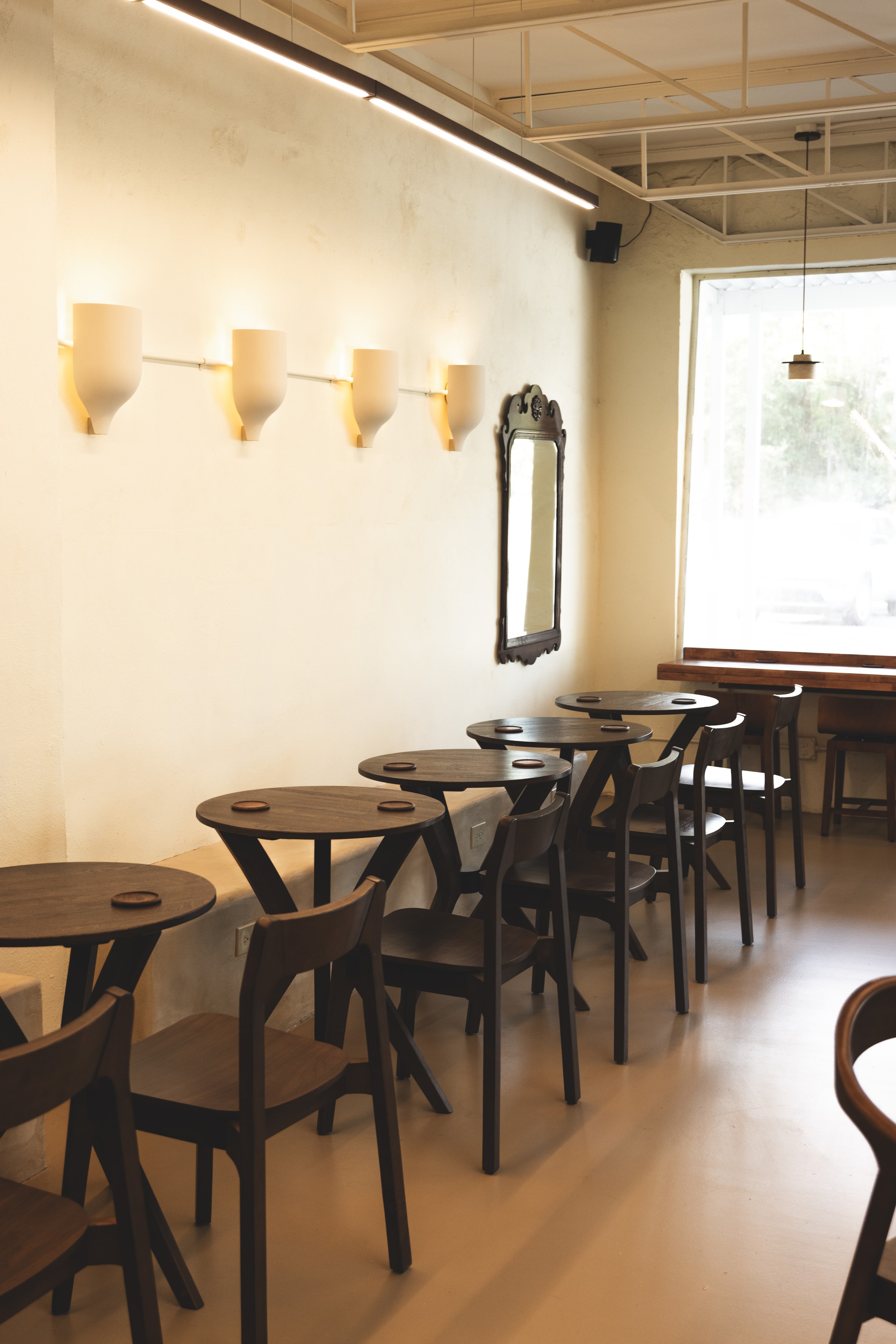 Cafe interior with wooden tables and natural light